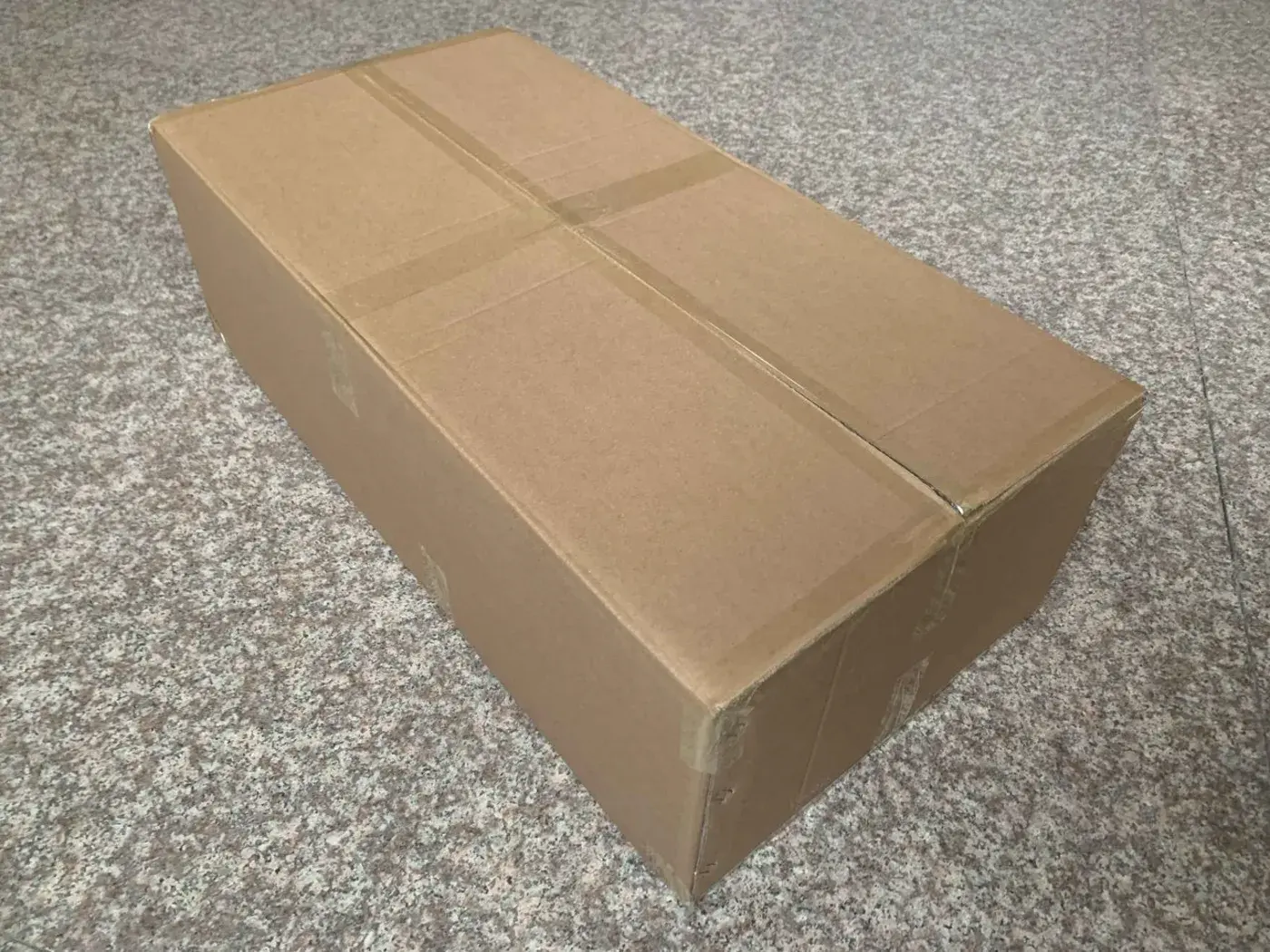 Sealed export carton checked for condition before shipment.