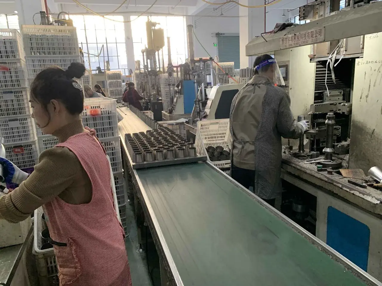 People working in a factory during the social compliance review.
