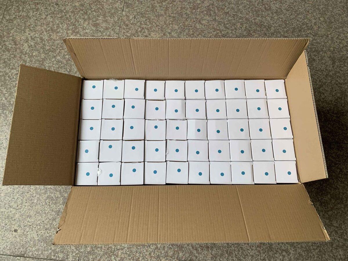 Cartons opened to verify packed units before shipment.