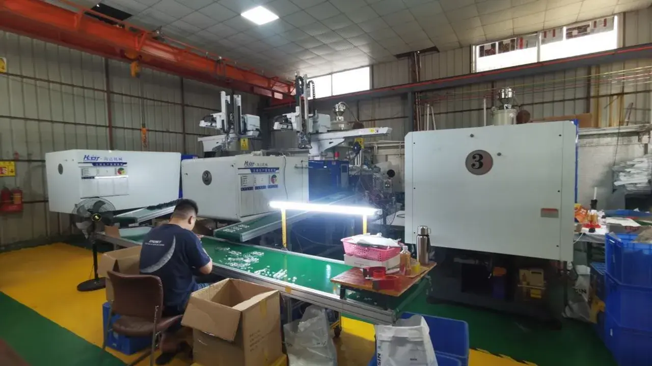 Production line with an operator and finished units available for an in-process quality inspection.